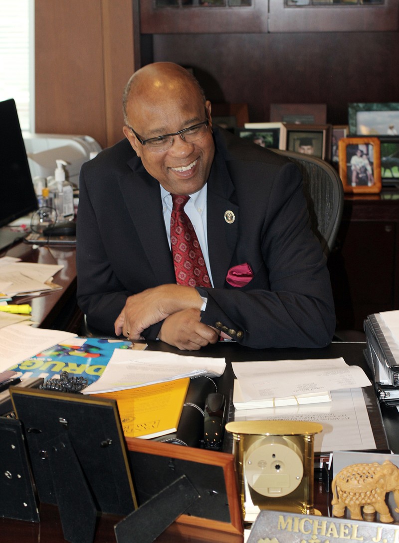 
              In this photo taken July 8, 2015, U.S. District Judge Michael Davis poses in his chambers in his Minneapolis chambers. Davis, who became chief judge of the Minnesota district in 2008, and recently stepped down from that post, will turn 68 later this month, but hasn’t said whether he’ll reduce his caseload. Several men and women have been prosecuted on terror charges in Minnesota since 2009, and all of them have eventually landed in front of Davis. (AP Photo/Jeff Baenen)
            