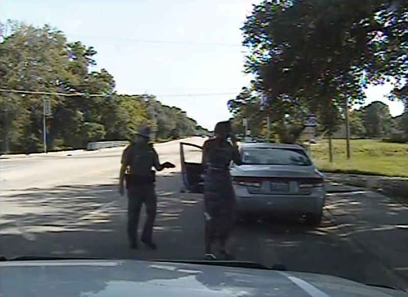 
              FILE- In this July 10, 2015 file frame from dashcam video provided by the Texas Department of Public Safety, trooper Brian Encinia arrests Sandra Bland after she became combative during a routine traffic stop in Waller County, Texas. Encinia, a Texas trooper who arrested Bland after a confrontation that began with a traffic stop, had been cautioned about “unprofessional conduct” in a 2014 incident while he was still a probationary trooper. (Texas Department of Public Safety via AP, File)
            
