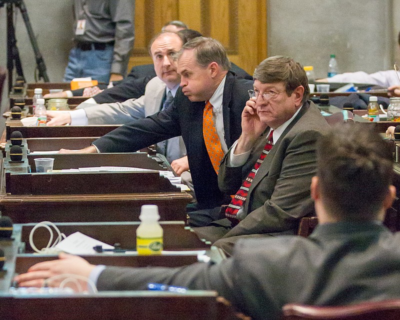 Lawmakers cast votes during a floor debate about the state's annual spending plan in Nashville on Thursday, April 10, 2014. From left are Republican Reps. Paul Bailey of Sparta, Bill Dunn of Knoxville and Harry Brooks of Knoxville.