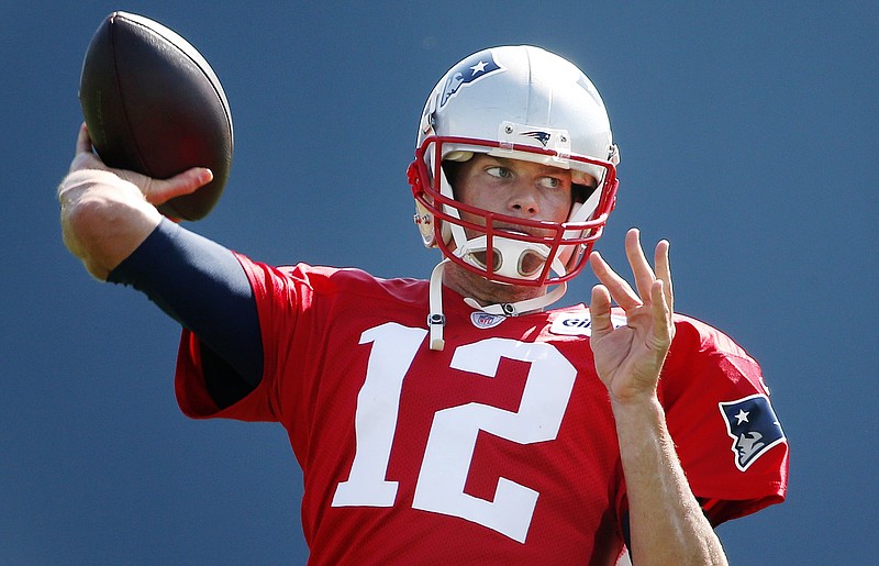 
              New England Patriots quarterback Tom Brady passes during an NFL football training camp in Foxborough, Mass., Saturday, Aug. 1, 2015. (AP Photo/Michael Dwyer)
            