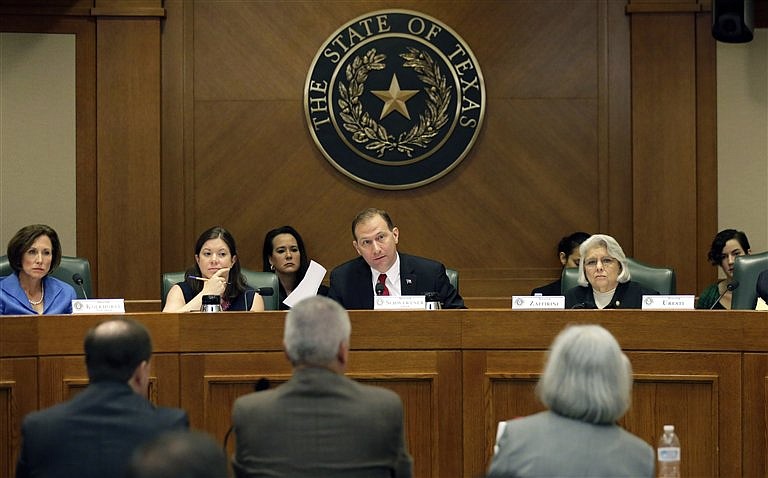 
              FILE- In this July 29, 2015, photo, Sen. Charles Schwertner, R-Georgetown, center, questions witnesses during a Texas Texas Senate Health and Human Services Committee hearing on Planned Parenthood videos covertly recorded that target the abortion provider in Austin, Texas. Texas is one of a number of GOP-controlled states that have launched investigations after the release of videos in which Planned Parenthood officials discuss how to harvest tissue for research from aborted fetuses.(AP Photo/Eric Gay, File)
            