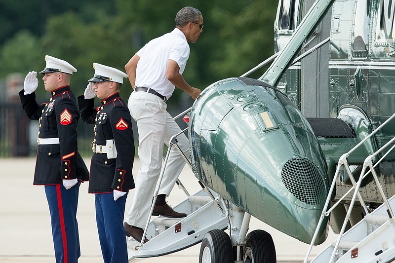 
              President Barack Obama boards Marine One at Andrews Air Force Base, Md., Saturday, Aug. 1, 2015, for a short trip to Camp David, after playing golf. In what has become an annual birthday tradition, the president started celebrating on Saturday by taking a trio of friends from his Hawaii childhood for a golf outing at Andrews Air Force Base. The group then will spend the night at the secluded Camp David presidential retreat in Maryland's Catoctin Mountains. (AP Photo/Andrew Harnik)
            