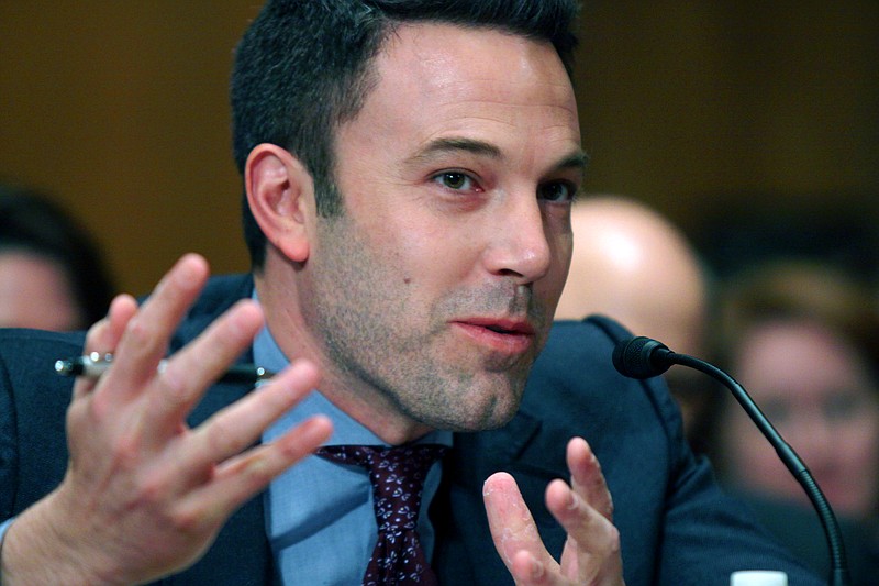 
              FILE - In this March 26, 2015 file photo, actor Ben Affleck testifies on Capitol Hill in Washington  before the Senate State, Foreign Operations, and Related Programs subcommittee hearing on diplomacy, development and national. security. "Finding Your Roots" will return for season three, but whether the celebrity genealogy series that buried an uncomfortable fact about Affleck's ancestor continues after that remains in doubt, PBS' chief executive said.(AP Photo/Lauren Victoria Burke)
            