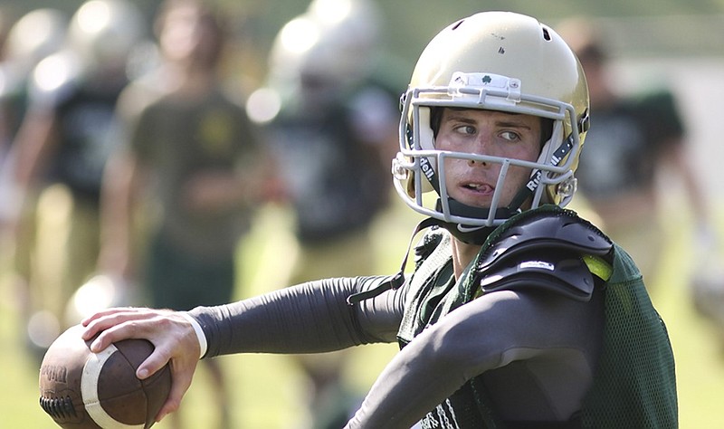 Notre Dame High School quarterback Alex Darras looks for an open receiver during the first day of practice in full pads for the 2015 football season.
