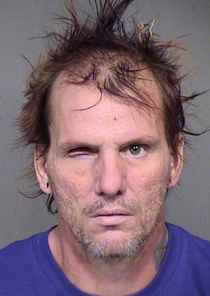 
              This booking photo provided by the Maricopa County Sheriff's Office shows 43-year-old Kenneth Dale Wakefield. Investigators say Wakefield killed and decapitated his 49-year-old wife, Trina Heisch, and their two dogs and then inflicted injuries on himself, including a severed left forearm and a missing eye. He was booked into Maricopa County jail Saturday afternoon, Aug. 1, 2015, on one count of first-degree murder and two counts of animal cruelty. (Maricopa County Sheriff's Office via AP)
            