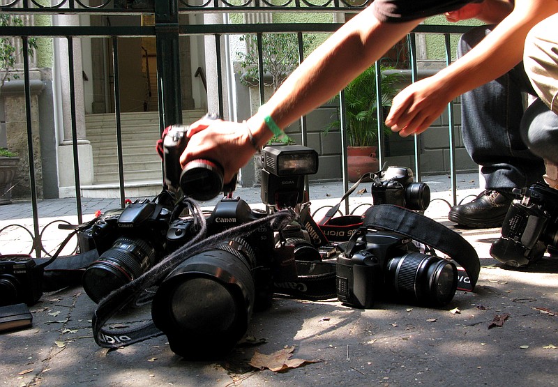 
              FILE - In this April 29, 2012, file photo, photojournalists place their cameras on the ground during a demonstration in Mexico City condemning the alleged murder of fellow journalist Regina Martinez, a correspondent for the Mexican investigative magazine Proceso. Ruben Espinosa, a photographer who worked for Proceso and other media, was among five people found slain early Saturday, Aug. 1, 2015, in an apartment in Mexico City, according to the magazine. He had recently gone into self-exile from the Gulf coast state of Veracruz, where he felt under threat, the magazine added. According to the Committee to Protect Journalists, 11 journalists have been killed in Veracuz since 2010, the most recent just a month ago. Two others, including Espinosa, were Veracruz journalists found dead outside of the state.  (AP Photo/Marco Ugarte, File)
            