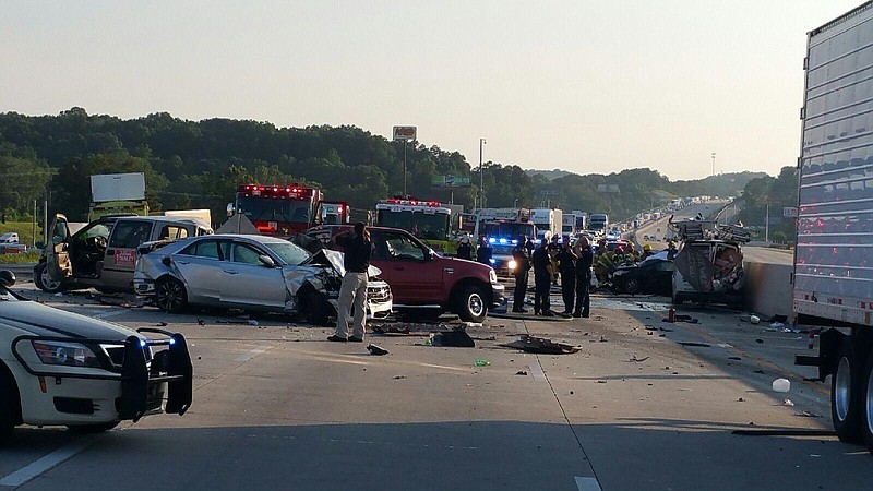 A Chattanooga Police Department Photo by Craig Joel shows scenes from the multiple fatality wreck at Exit 11 in Ooltewah.