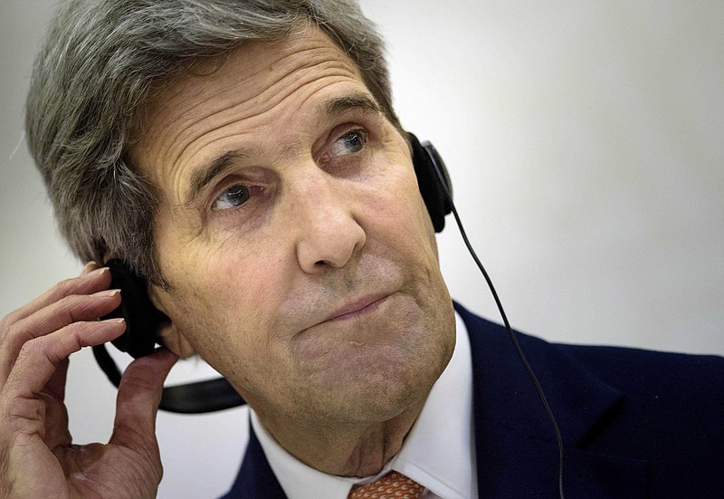 
              U.S. Secretary of State John Kerry listens to an interpreter during a press conference following a meeting with foreign ministers of the Gulf Cooperation Council (GCC) on Monday, Aug. 3, 2015 in Doha. Qatari Foreign Minister Khaled al-Attiyah on Monday backed the deal on Iran's nuclear program as the best available option, after talks in Doha with US Secretary of State John Kerry. (Brendan Smialowski/pool photo via AP)
            