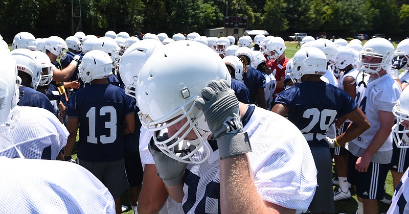 UTC players gather during the first day of football practice for the University of Tennessee at Chattanooga on Sunday, Aug. 3, 2015, in Chattanooga, Tenn.