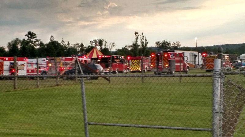 
              Officers surround the scene of a tent collapse in Lancaster, N.H., Monday, Aug. 3, 2015. Authorities say the circus tent collapsed when a severe storm raked the New Hampshire fairground. (Sebastian Fuentes via AP)
            