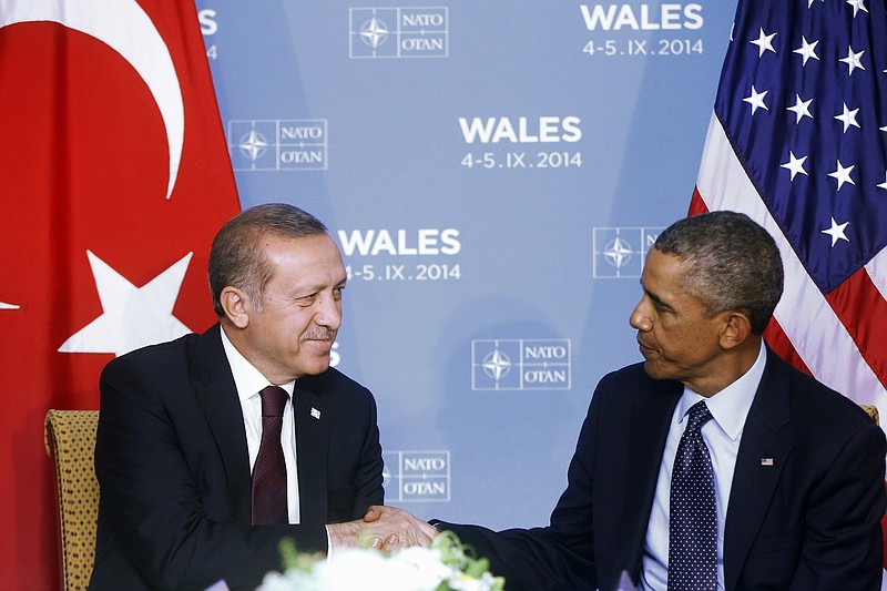 
              FILE - In this Sept. 5, 2014, file photo, President Barack Obama and Turkish President Recep Tayyip Erdogan shake hands after they made statements to reporters at their meeting at the NATO summit at Celtic Manor, Newport, Wales. Obama and Erdogan are both taking a big gamble as they agree to work together against the Islamic State group militants in Syria. (AP Photo/Charles Dharapak, File)
            