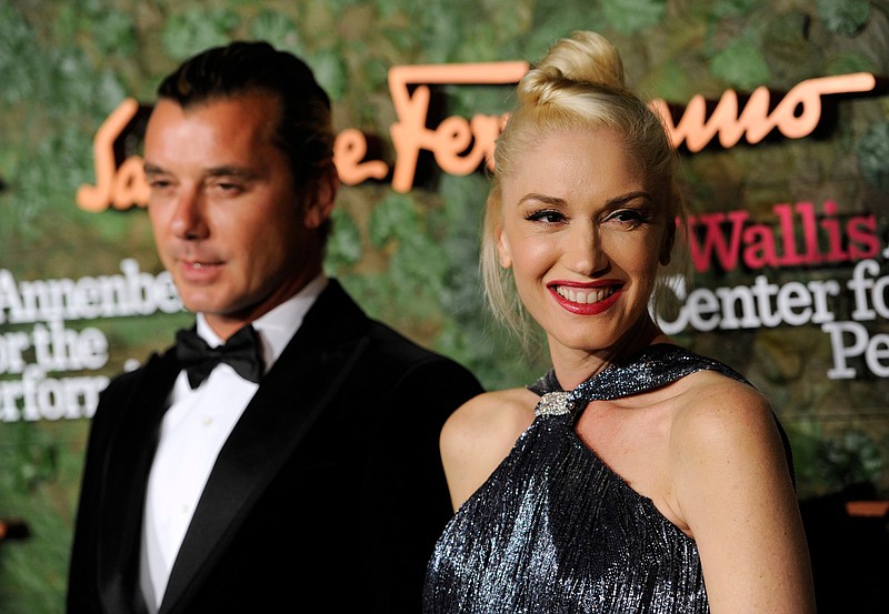 In this Oct. 17, 2013, file photo, Gavin Rossdale, left, and Gwen Stefani arrive at the Wallis Annenberg Center for the Performing Arts Inaugural Gala in Beverly Hills, Calif. Stefani filed for divorce Monday, Aug. 3, 2015, in Los Angeles, from Rossdale, citing irreconcilable differences. Both parties are seeking joint custody of their children. (Photo by Chris Pizzello/Invision/AP, File)
            