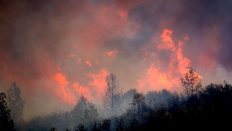 
              A fire burns to the north of U.S. Highway 20 east of Spring Valley in Lake County, Calif., Monday, Aug. 3, 2015. Firefighters were working aggressively to regain control after a raging California fire jumped a highway that had served as a containment line for the massive blaze, which is one of 20 wildfires burning in California. (Kent Porter/The Press Democrat via AP) MANDATORY CREDIT
            