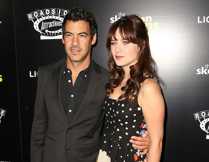 
              FILE- In this Sept. 10, 2014 file photo, Jacob Pechenik, left, and Zooey Deschanel  attend "The Skeleton Twins," premiere at ArcLight Theatre in Los Angeles. A spokeswoman for the 35-year-old entertainer confirmed Tuesday, Aug. 4, 2015, that Deschanel recently married Jacob Pechenik and gave birth to the couple’s baby girl. No other details were provided. (Photo by Brian Dowling/Invision/AP, File)
            