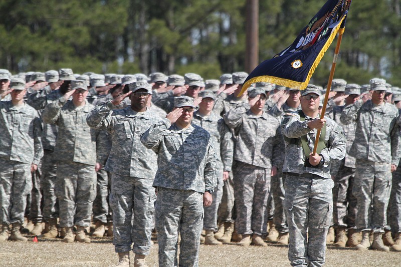 Members of the Louisiana National Guard's 256th Infantry Brigade Combat Team participate in a casing ceremony as their training comes to an end at Camp Shelby in Hattiesburg, Miss., Friday, March 5, 2010. About 10,000 family members and supporters were expected to attend the sendoff of about 3,000 Louisiana and about 400 Virginia based soldiers. The ceremonies mark the brigade's second deployment to Iraq. (AP Photo/Rogelio V. Solis)
