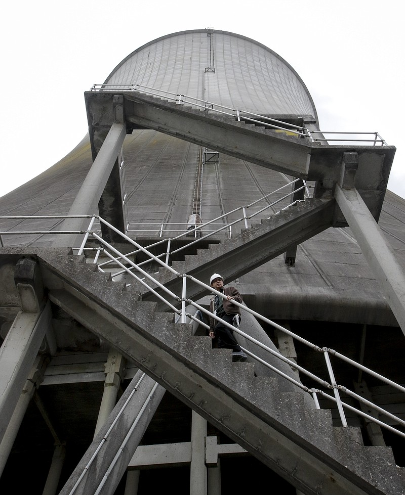 Unit 2 senior manager of operations Tom Wallace walks up the stairs to the Unit 2 cooling tower of TVA's Watts Bar nuclear plant Wednesday, April 29, 2015, in Spring City, Tenn. TVA plans for the nuclear plant's second reactor unit to come online by the end of the year.