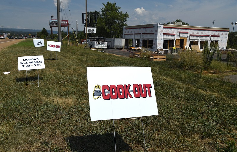 Signs are posted Tuesday, August 4, 2015, at the new Cook Out location on Highway 153.