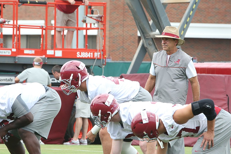 Alabama football coach Nick Saban watches over Thursday's practice, which was the first of the preseason for the Crimson Tide.