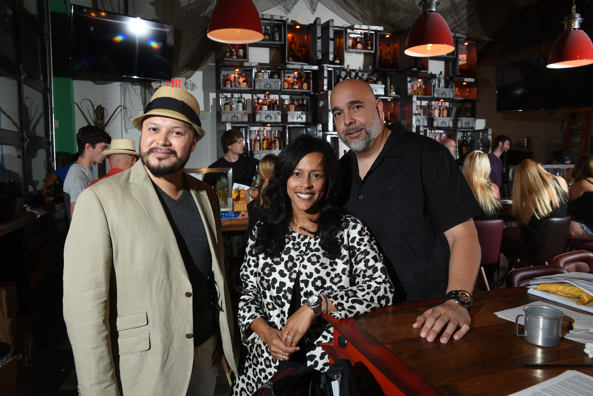 Brittany and Daniel Alcala, right, are owners of Embargo 62, Cuban Cantina and Rum Bar on the North Shore. Danny Valdez, left, is the mixologist.