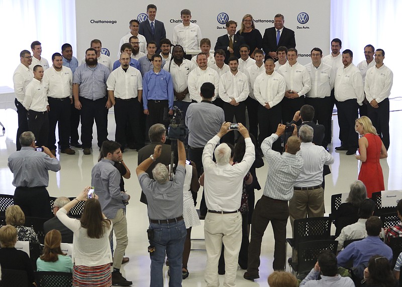 New graduates of Volkswagen Chattanooga's Automation Mechatronics Program and Car Mechatronics Programs have their photos taken at the conclusion of their graduation ceremony on August 6, 2015. Twenty-five students graduated completing a three-year educational program. 