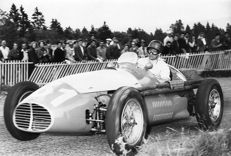 
              FILE - In this undated file photo, Argentina's Juan Manuel Fangio drives his Maserati race car to win the hill race in the Swiss Jura, Switzerland, at the race track Vue des Alpes. The body of the late Formula 1 star was exhumed in Argentina on Friday, Aug. 7, 2015 by orders of a judge for testing to determine paternity claims brought by two men who believe they are his sons. Fangio, who died in 1995, was never married and did not recognize having any children during his life. Fangio won five world titles between 1951 and 1957. (AP Photo/File)
            