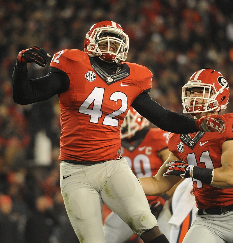 Georgia linebacker Tim Kimbrough, shown here celebrating a play last year against Auburn, will call the signals this season for Jeremy Pruitt's defense.