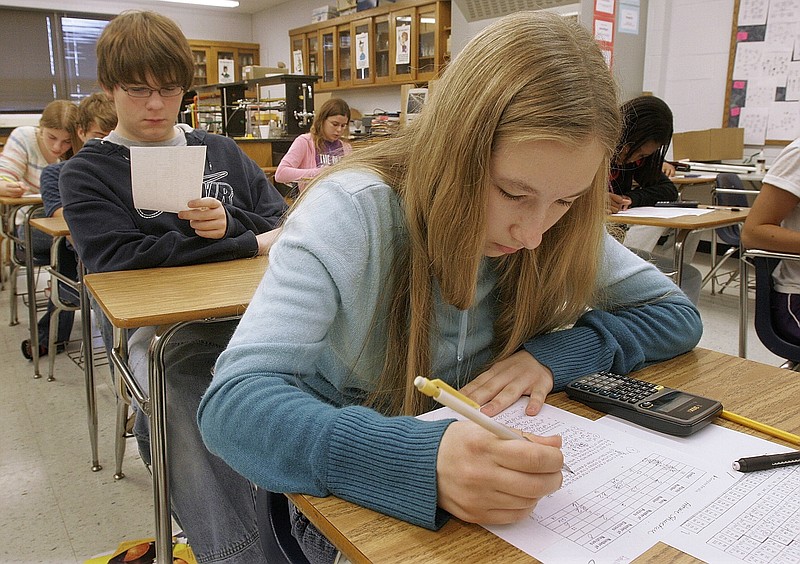 Every year, students take tests to determine whether schools here and elsewhere meet or exceed standards. Hamilton students tested poorly last year. This classroom was in Illinois. (AP Photo/Seth Perlman)