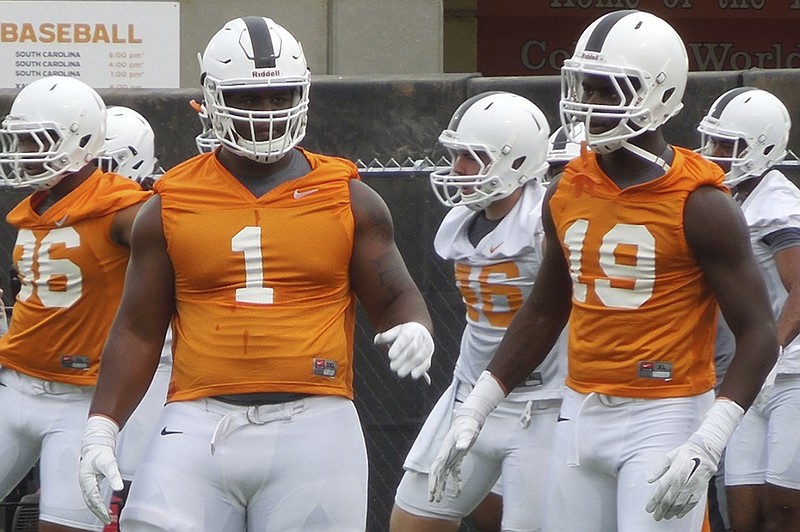 Kahlil McKenzie, left, is among the young tackles Tennessee is counting on to contribute for a defensive line that will be thin on experience entering the season.