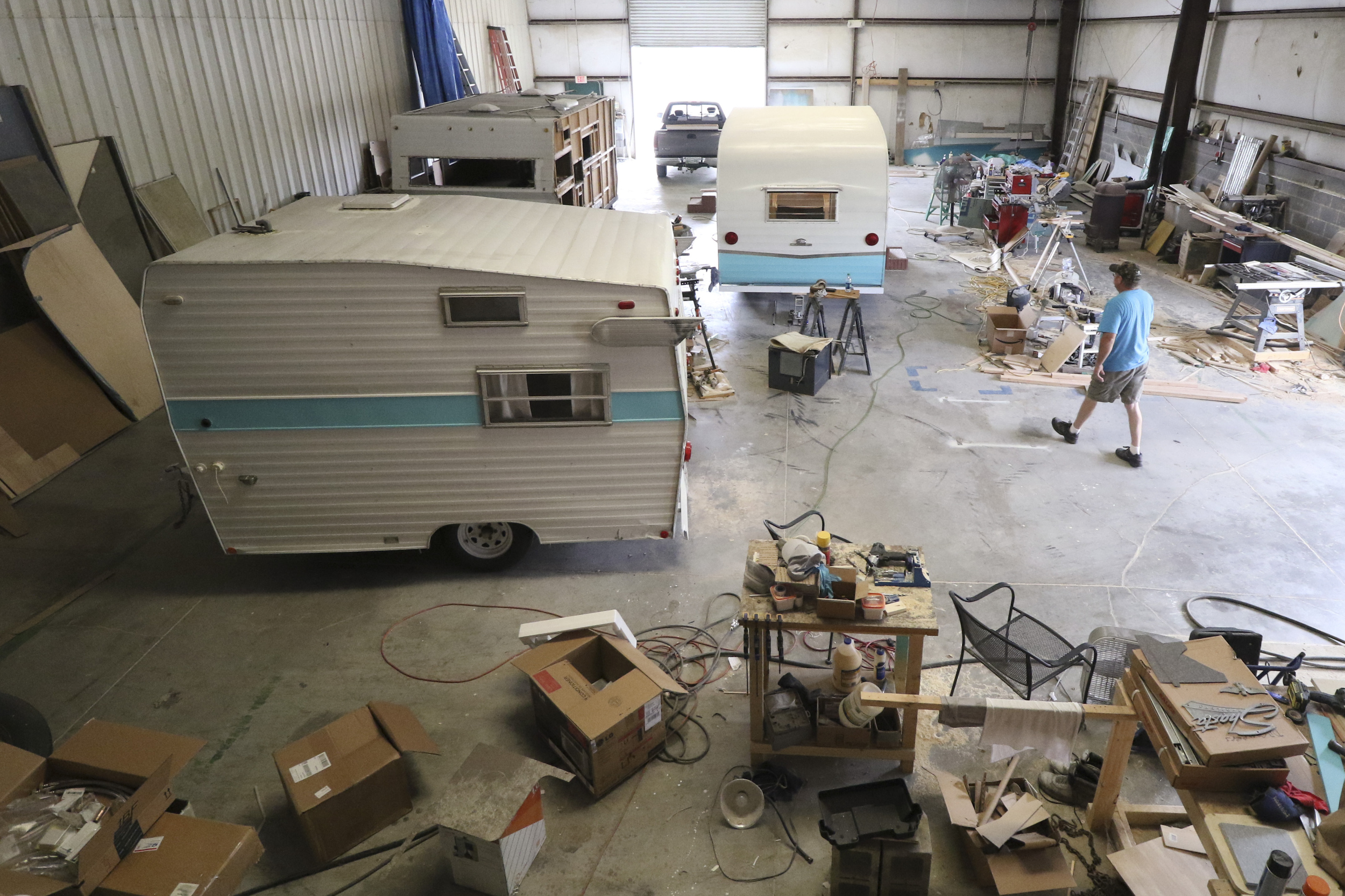 Butch Bloodworth walks past a 1961 Shasta Air Flyte that he and his brother are renovating at D.B. Vintage Campers in Rossville, Georgia, on July 30, 2015. The siblings started custom rebuilds of period campers two years ago and have over a dozen to complete on their lot.