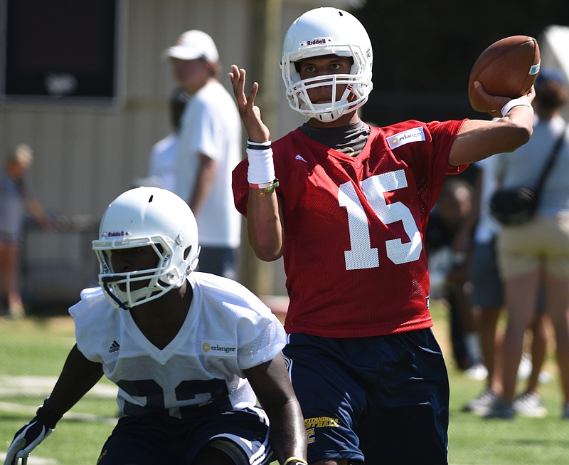 Quarterback Alejandro Bennifield trows a pass during the first day of football practice for the University of Tennessee at Chattanooga on Monday, Aug. 3, 2015, in Chattanooga.