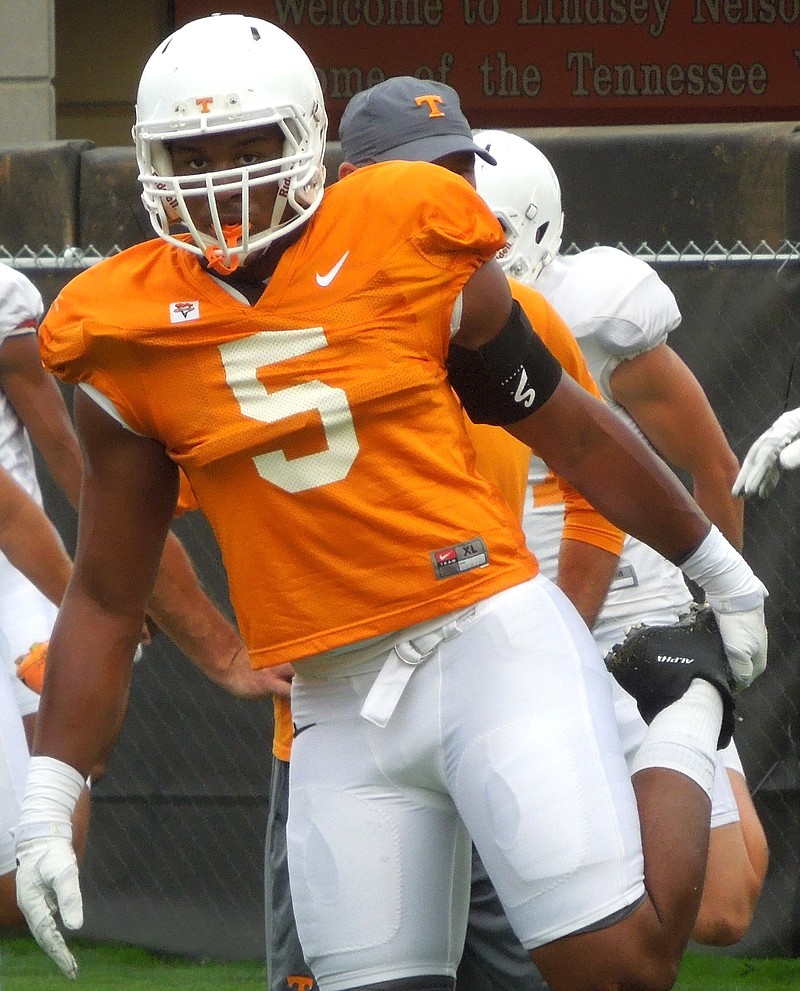 Tennessee freshman defensive end Kyle Phillips stretches before the Vols' practice at Haslam Field on Aug. 11, 2015.