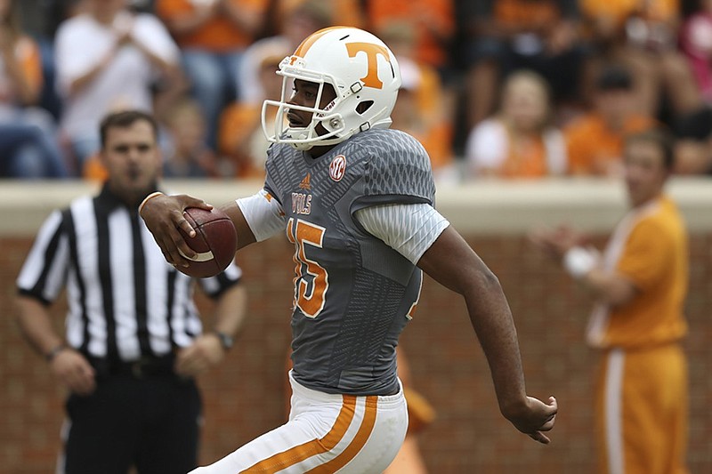 Tennessee's Jauan Jennings scores on a touchdown run during the Volunteers' annual Orange and White Game in April. Jennings has since moved from quarterback to wide receiver, where he has impressed teammates and coaches during preseason camp.