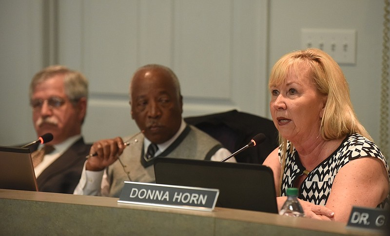 Donna Horn, right, speaks Thursday as George Ricks Sr., center, and Superintendent Rick Smith listen during the Hamilton County School Board meeting about their vote to ask the county commission in May for a $34 million budget boost.
