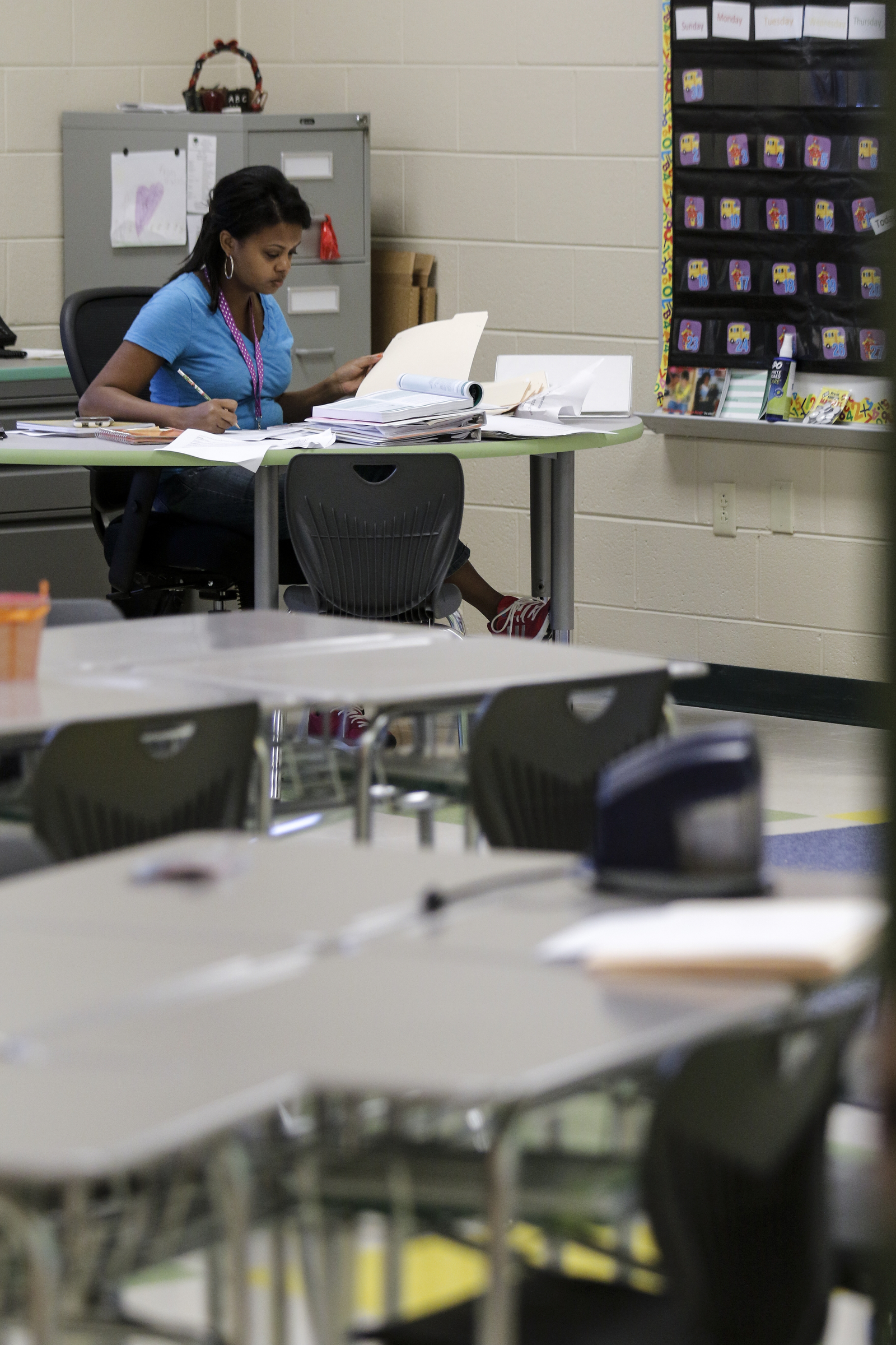 Second grade teacher April Morris works to prepare for the first day of school in her classroom Wednesday, Aug. 12, 2015, at the new East Brainerd Elementary School in Chattanooga, Tenn. Thursday is Hamilton County's first day of school.
