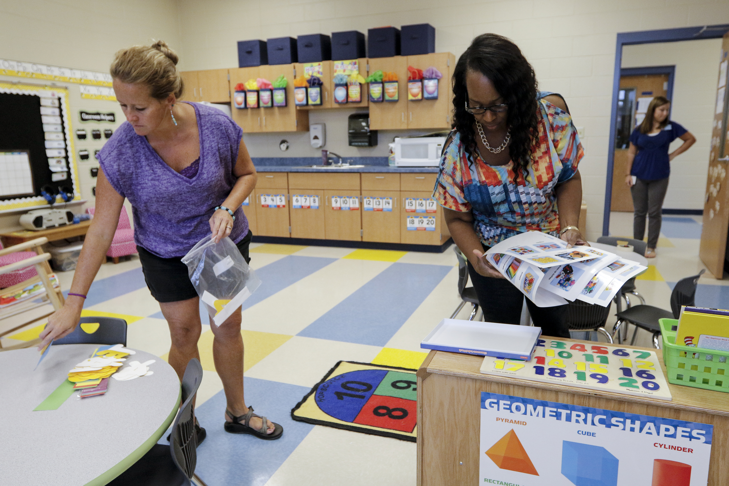 Pre-kindergarden teacher Sharon Ferguson, right, and assistant teacher Donielle Adamson work to get their classroom ready for the first day of school Wednesday, Aug. 12, 2015, at the new East Brainerd Elementary School in Chattanooga, Tenn. Thursday is Hamilton County's first day of school.