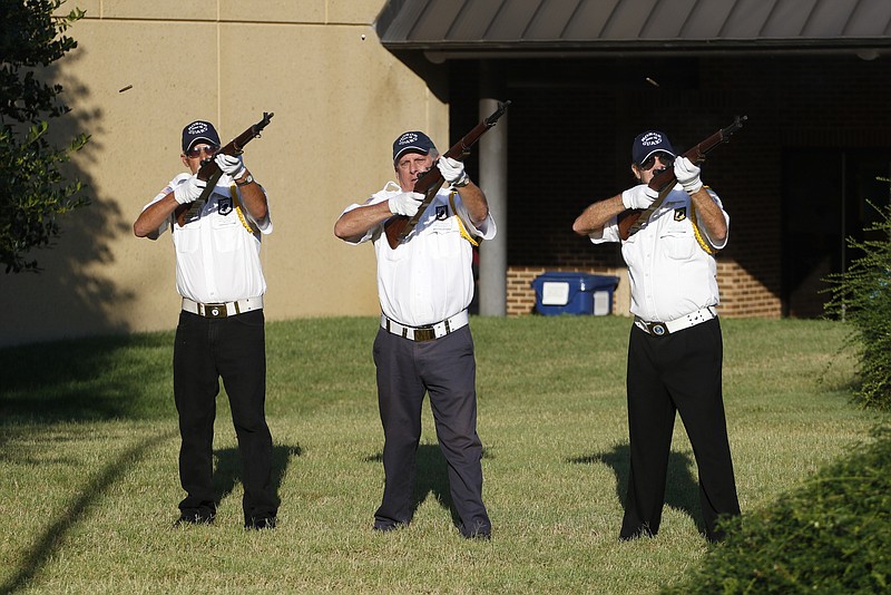 Ron Tatum, Jim Grisard and Don Long fire three rounds into the air during a flag retirement ceremony at Heritage Plaza on The University of Tennessee at Chattanooga campus on Wednesday, August 12, 2015. The Student Veterans Organization and the Dean of Students Veteran Services hosted the ceremony to retire the flag that flew at half-staff in mourning for the five military service members that were killed on July 16, 2015.