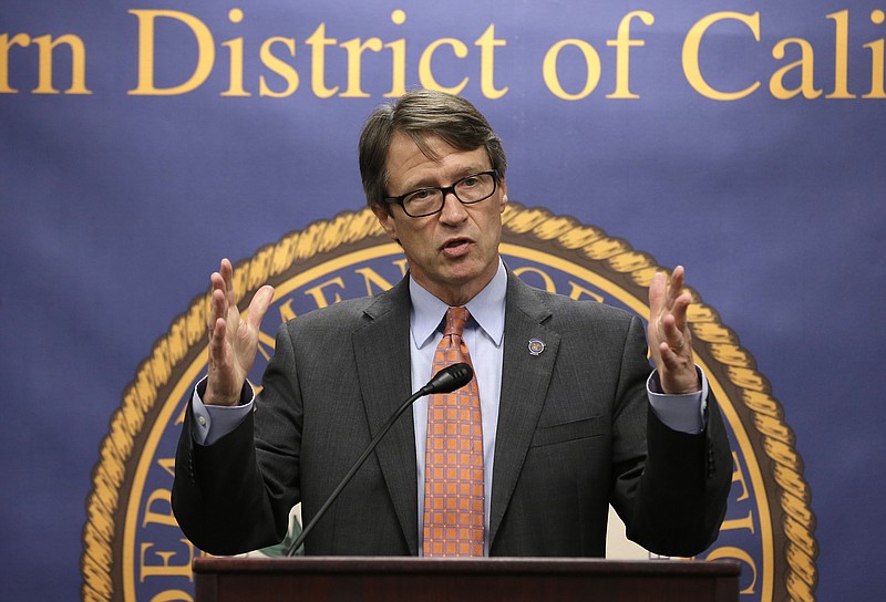
              Benjamin B. Wagner, United States Attorney for the Eastern District of California, discusses the investigation into a scheme where as many as 100 commercial truck drivers paid up to $5,000 to  California Department of Motor Vehicle employees for illegal California licenses, Tuesday, Aug. 11, 2015, in Sacramento,Calif.  Court records say that three DMV employees, two in Salinas and one in Sacramento, changed computer records to falsely show that drivers passed written and behind-the-wheel tests. The owners of three truck driving schools have also been charged with conspiracy to commit bribery and to commit identity fraud.  (AP Photo/Rich Pedroncelli)
            