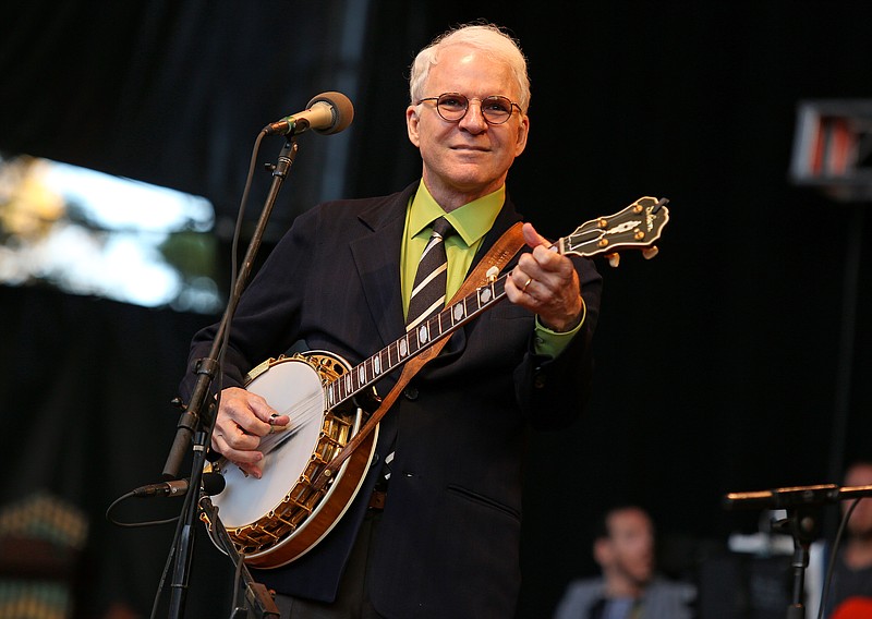 
              FILE - In this Oct. 20, 2012 file photo, Steve Martin performs at the Shoreline Amphitheatre in Mountain View, Calif. Martin will be honored by the International Bluegrass Music Association with a distinguished achievement award. The association announced special awards recipients and nominees on wednesday, Aug. 12, 2015, for the International Bluegrass Music Awards, which will be presented in Raleigh, N.C., on Oct. 1. (Photo by Barry Brecheisen/Invision/AP, File)
            