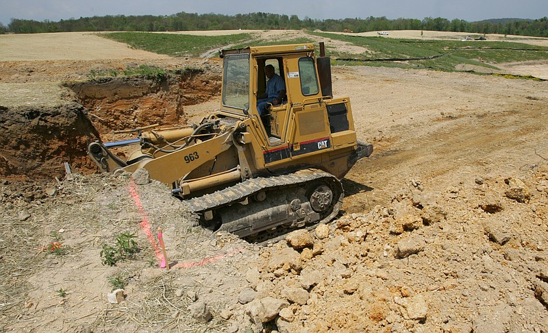 A bulldozer moves earth at the Barrington Pointe sub-division near Soddy Daisy.