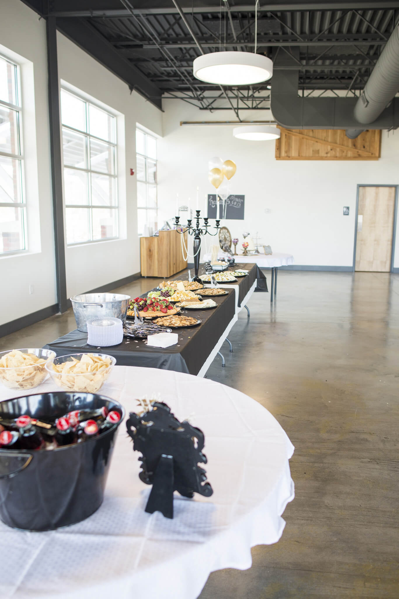 At 2 On the Roof, a modern industrial decor is reflected in the polished concrete floors and open ceiling with pendant lights.