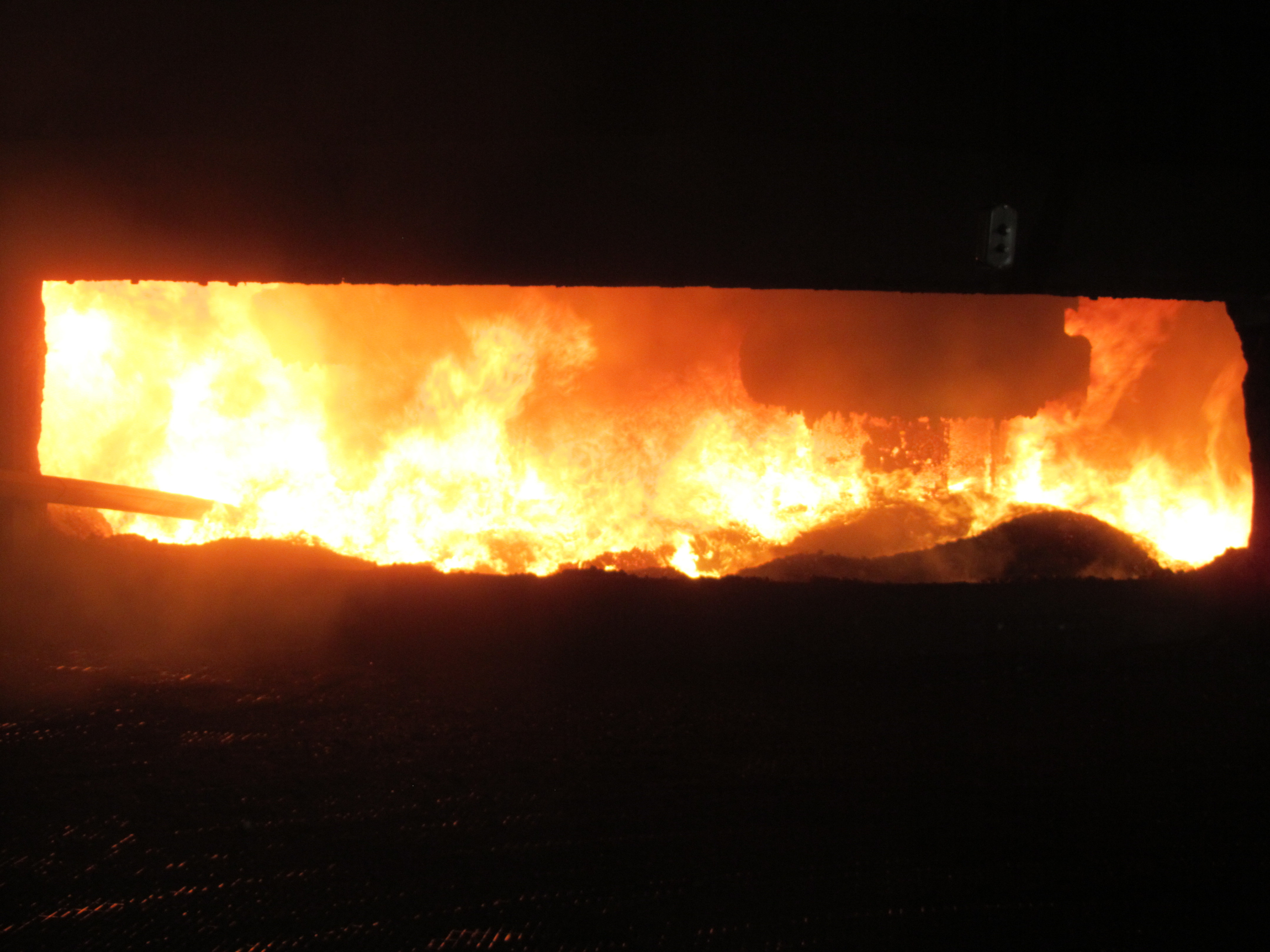Potential Caption: Tapping the furnace at Tennessee Alloys Company, part of Globe Specialty Metals.