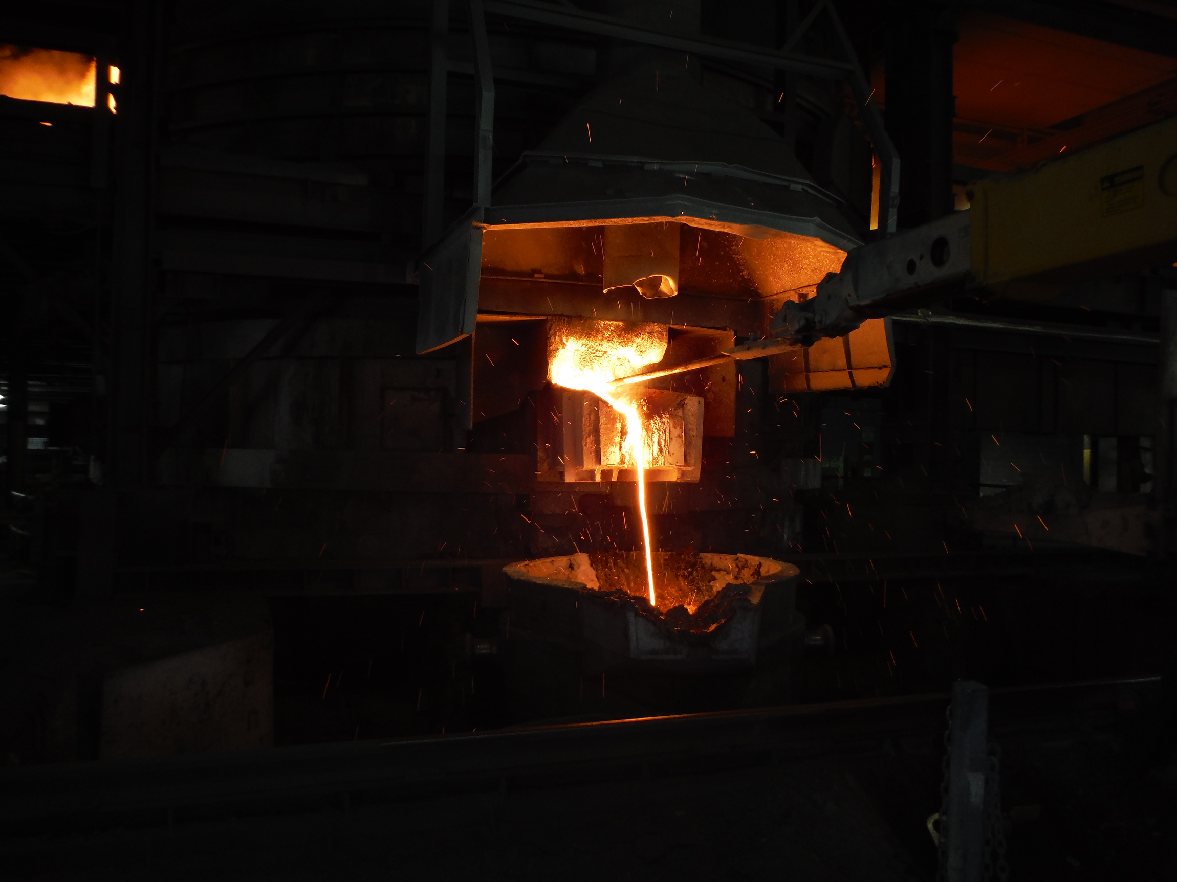 Potential Caption: Tapping the furnace at Tennessee Alloys Company, part of Globe Specialty Metals.