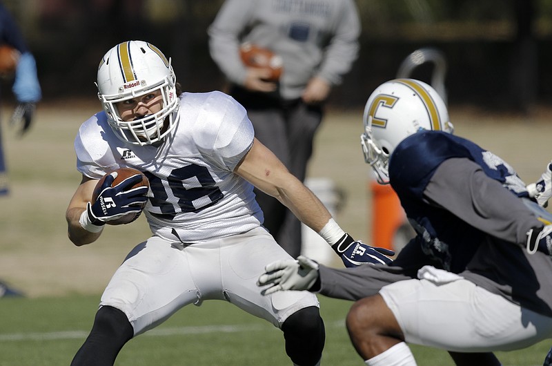 UTC running back Derrick Craine rushes the ball during the Mocs' first spring football scrimmage Saturday, March 28, 2015, at Scrappy Moore Field in Chattanooga, Tenn.