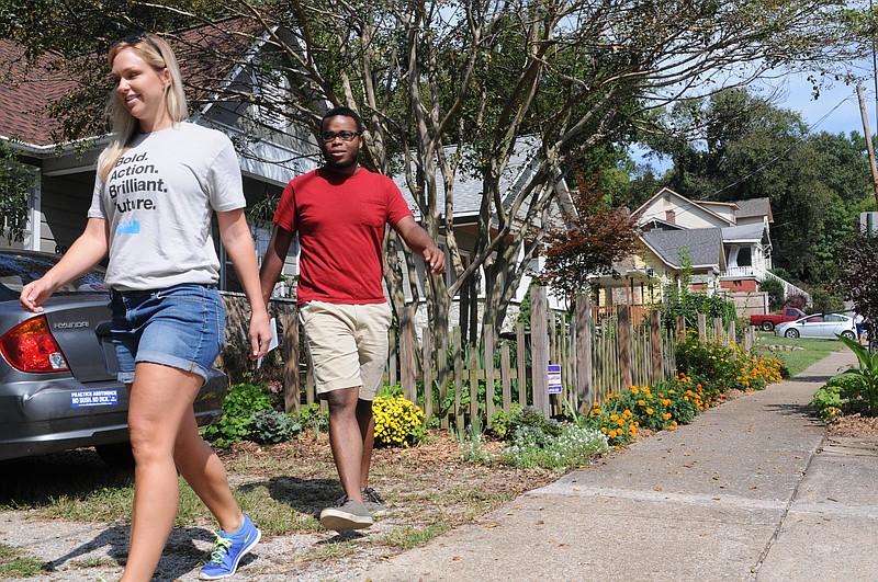File Photo by Tim Barber/Chattanooga Times Free Press - Last September Christina Siciliano, left, and Rudy Foster worked with UnifiEd to go door-to-door in North Chattanooga inviting residents to a Community Summit on public education in Hamilton County.