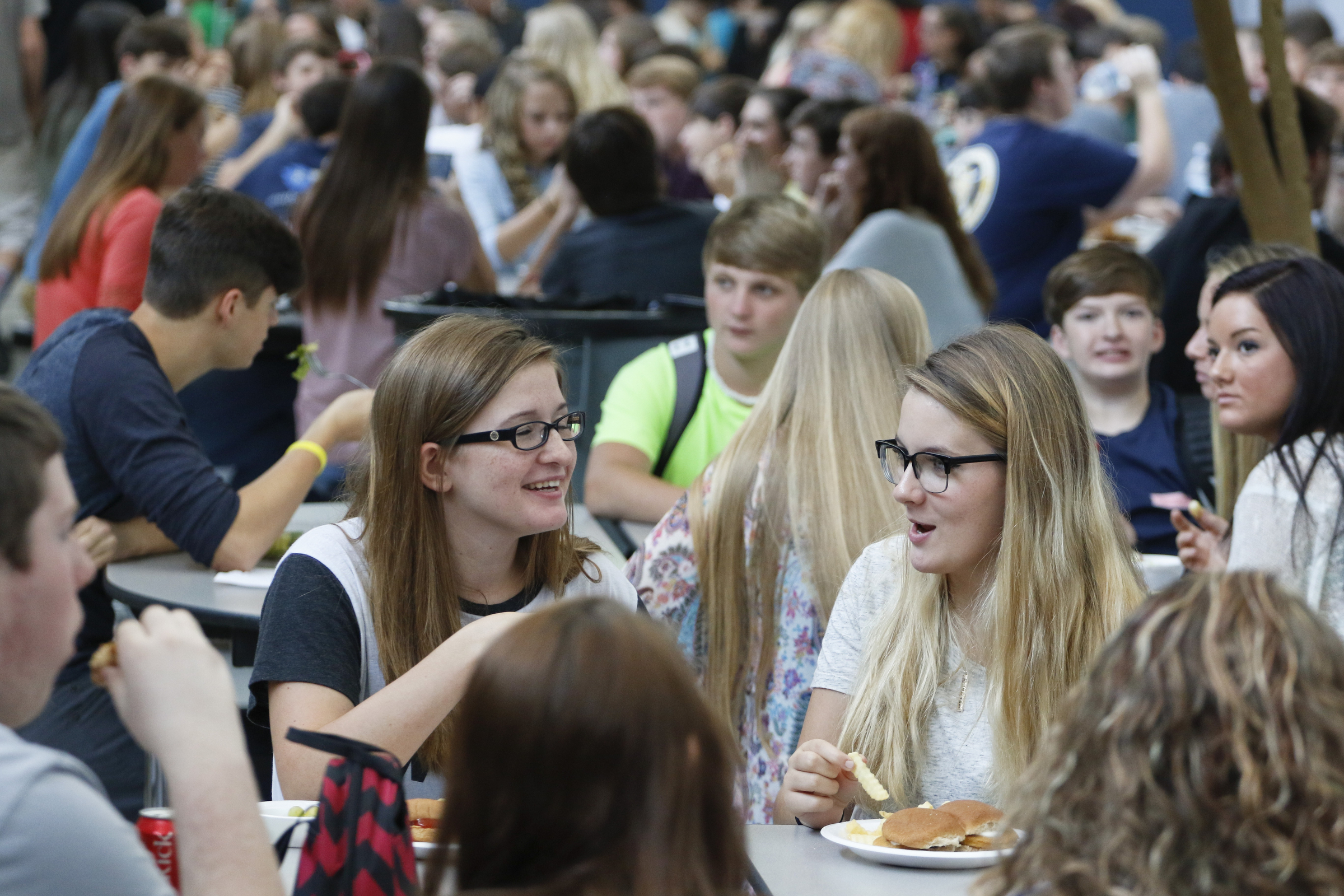 Soddy-Daisy High School junior classmen Brittany O'Dell, left, and Delaney Mercer enjoy lunch and conversation during the first day of school on Thursday, August 13, 2015.