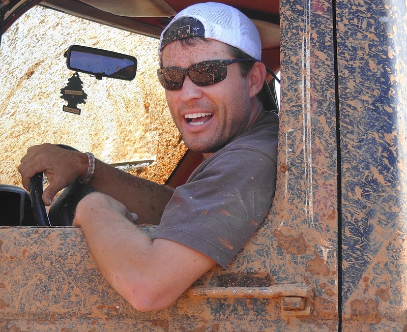 A mudding enthusiest drives his truck around Red Neck Resort in this 2012 file photo.