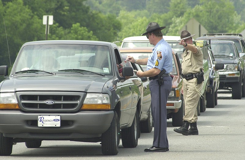 Georgia Highway Patrol officers and Walker County Sheriff Deputies check every driver on GA 193 at a sobriety checkpoint.