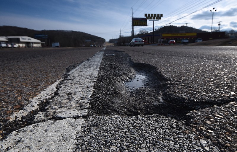 File Photo by Tim Barber/Chattanooga Times Free Press - Eroding asphalt on state roads is just one of the problems Tennesseans face as the state nears a crisis with transportation funding.