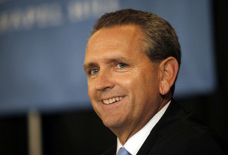 
              FILE - In this Oct. 14, 2011, file photo, Bubba Cunningham smiles during a news conference after being introduced as the new athletic director at the University of North Carolina in Chapel Hill, N.C.   North Carolina continues to be plagued by its long-running academic scandal. University officials say they have discovered more violations related to the scandal while preparing UNC’s response to the notice of allegations they received from the NCAA in May. The response, due next week, has been delayed. (Shawn Rocco/The News & Observer via AP, File)
            