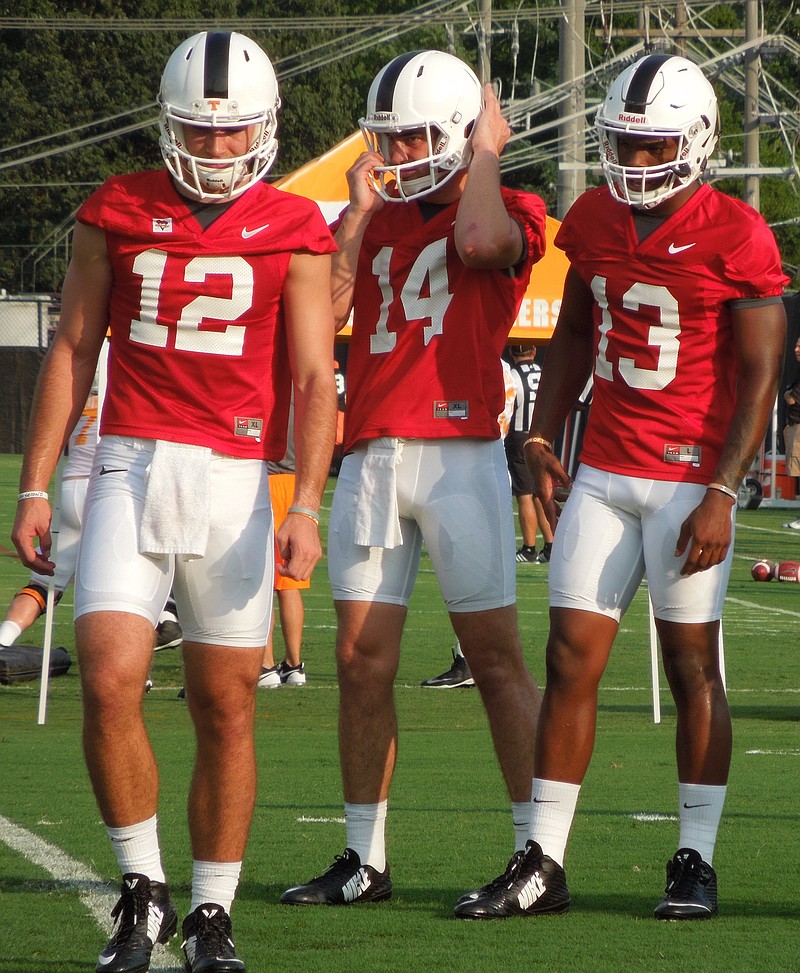 Tennessee quarterbacks Quinten Dormady (12), Zac Jancek (14) and Sheriron Jones (13) look on during the Vols' first preseason practice at Haslam Field on Aug. 4, 2015.